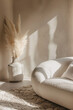 © gamespirit - A close-up shot of the sofa in neutral tones, bathed in soft sunlight that creates gentle shadows on its surface and surrounding wall. A vase with pampas grass adds an organic touch to the space.