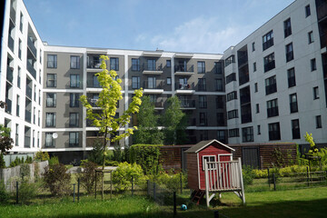 Wall Mural - Modern multistorey building and patio with trees