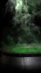 Wall Mural - vertical witch cauldron smoking green 4k loop features a metal cauldron with green glowing smoke ris
