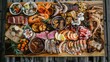 © buraratn - Aerial shot of a seafood, pork, and beef barbecue spread on a wooden platter, showcasing delicious meat varieties from above.