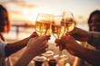 © pangamedia - a group of friends caucasian an African American hands toasting champagne glasses for new years eve with a beach background, a celebration or engagement concept