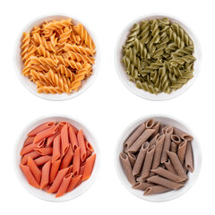 Wall Mural - Fusilli and penne, gluten-free pasta, noodles made without wheat flour, in white bowls. Above yellow chickpea fusilli and green pea fusilli, below red lentil penne and brown buckwheat penne.