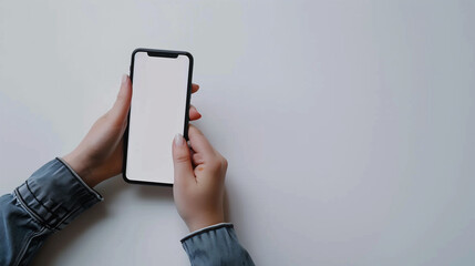 A pair of hands holding a blank smartphone screen, ready for customization or app presentation, representing technology, communication, and modern devices.