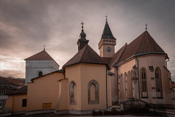 Wall Mural - church on the side of a hill with a clock on its face