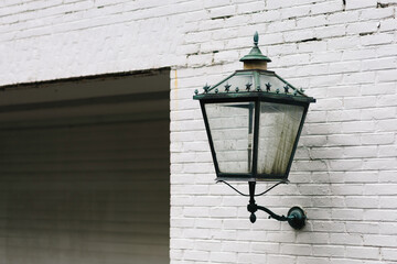 Wall-Mounted Vintage Lantern on White Brick Exterior