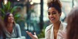 © gunzexx png and bg - Charismatic young professional woman engaging with colleagues in a meeting at a modern workplace