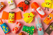 © Avocado_studio - Toilet paper crafts on a colored background. Kids crafts made with toilet paper roll. DIY. Handmade. Paper toys. Origami animals. Concept of children's educational games. Place for text. Copy space.