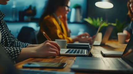 Two women working late in the office.