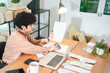 © chokniti - Late-night freelancer, Dedicated Asian woman working overtime on laptop computer, meeting deadlines in the sleepy Night, Businesswoman burning the midnight to working hard, sleep at working desk