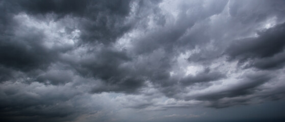 Aufkleber - The dark sky with heavy clouds converging and a violent storm before the rain.Bad or moody weather sky and environment. carbon dioxide emissions, greenhouse effect, global warming, climate change.
