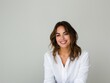 © Restyler - Stylish young brunette woman smiling on a white background. Beauty and fashion. Style.