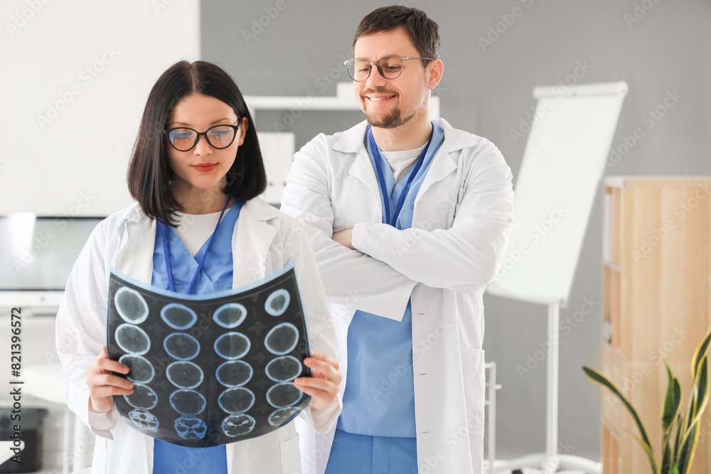 Doctors studying MRI scan in clinic