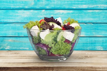 Wall Mural - Mixed fresh tasty vegetable Salad in bowl