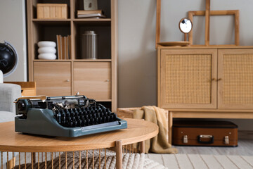 Canvas Print - Vintage typewriter on table in living room, closeup