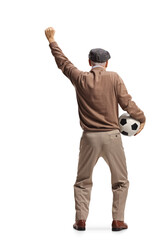 Sticker - Rear view shot of a happy elderly man holding a football and cheering