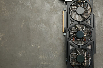 Poster - One graphics card on grey table, top view. Space for text