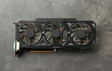 Poster - One computer graphics card on grey textured table, top view