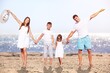 © BillionPhotos.com - Yong happy family at the sea beach.