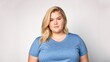© BlackBird Studio - Chubby blonde woman on a light isolated background