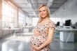 © BillionPhotos.com - Happy young pregnant woman holding tummy