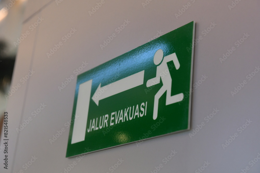evacuation route signs at the corridor in building Stock Photo | Adobe ...