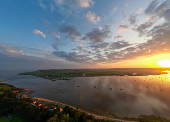 Wall Mural - An aerial view of a spectacular sunset over the River Deben at Bawdsey Beach in Suffolk, UK