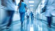 © Ruslan Gilmanshin - Doctors or nurses walking in hospital hallway, blurred motion