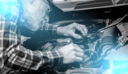 Wall Mural - Car mechanic working on car engine; light effect