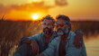 © Visual Craft - Couple of middle aged happy gay men very much in love watching sunset together