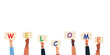 © pexelsstock - Raised arms of colleagues or friends diverse multi ethnic multicultural people holding letters Welcome