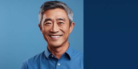Wall Mural - Blue Background Happy asian man. Portrait of older mid aged person beautiful Smiling boy good mood Isolated on Background ethnic diversity equality acceptance concept 
