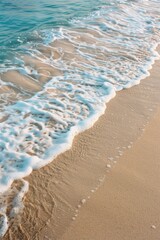 Poster - Wave approaching sandy beach, ideal for travel brochures or vacation websites