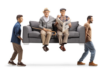 Wall Mural - Elderly men sitting on a sofa carried by young men