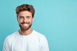 © Zickert - Turquoise background Happy european white man realistic person portrait of young beautiful Smiling man good mood Isolated on Background Banner with copyspace blank empty