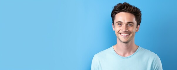 Wall Mural - Blue background Happy european white man realistic person portrait of young beautiful Smiling man good mood Isolated on Background Banner with copyspace 