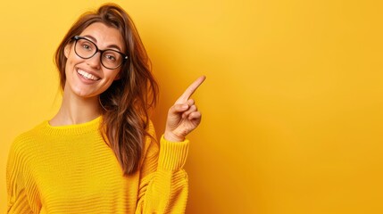 Woman pointing finger at empty floor on a yellow background