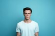 © Zickert - Cyan background sad european white man realistic person portrait of young beautiful bad mood expression man Isolated on Background depression anxiety fear burn out health issue problem mental overstra