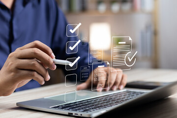 Canvas Print - Business performance monitoring and evaluation concept, Take an assessment, Business man using laptop and tablet online checklist survey, Filling out digital checklist, Questionnaire with checkboxes.