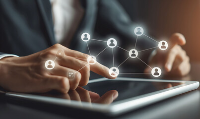 Leinwandbilder - A businessman using a digital tablet to manage customer relationships, featuring a virtual network overlay of interconnected icons, representing CRM and global communication