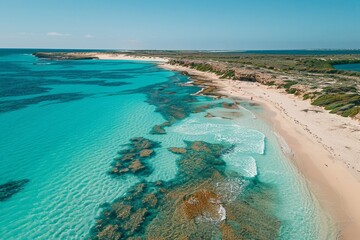 Sticker - Drone Shot of a Serene Coastal Landscape Showcasing Clear Turquoise Waters and Lush Greenery