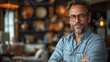 © Claudine - happy male executive company owner corporate manager leader in office confident smiling business man professional coach wear glasses stand arms crossed staring at camera.photo illustration