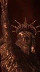 Wall Mural - vertical atmospheric liberty statue twist 4k features the upper half of the statue of liberty in a r