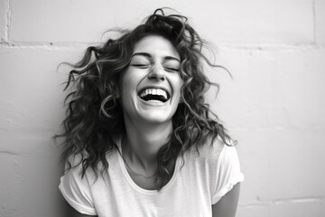 Wall Mural - Portrait of a glad woman in her 20s laughing in plain cyclorama studio wall