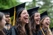 © Olivia - Group of graduates, laughing and celebrating