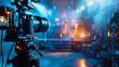 © Lull - Professional camera recording live event. Professional video camera setup on a tripod capturing a concert or live music event, with blurred stage lights in the background.