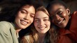 © venusvi - A close-up photo of three diverse female friends with infectious smiles, their eyes sparkling with joy.