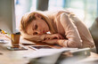 © peopleimages.com - Sleeping, business and woman at desk in office for exhausted, tired and overworked from burnout of low energy. Corporate, person and fatigue with stress, nap and pressure from project deadline