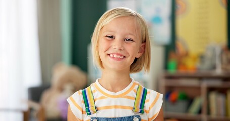 Fototapete - Girl, child and face or happy in classroom for education, knowledge or fun learning with confidence. Student, person and portrait with smile at kindergarten for studying, pride and academy or school