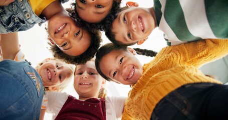 Poster - Huddle, support and happy children in school for education, community or development. Low angle, diversity and group of friends with smile in playground for solidarity, teamwork or playing together