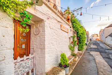 Trulli of Alberobello, Puglia, Italy. town of Alberobello with trulli houses among green plants and flowers